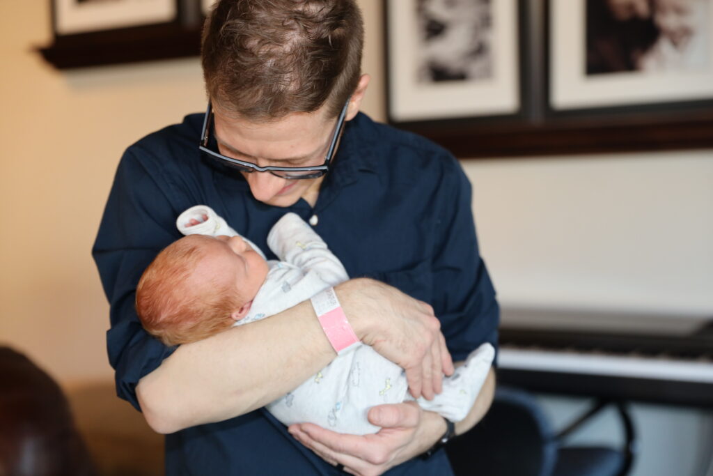 Father holding his newborn baby