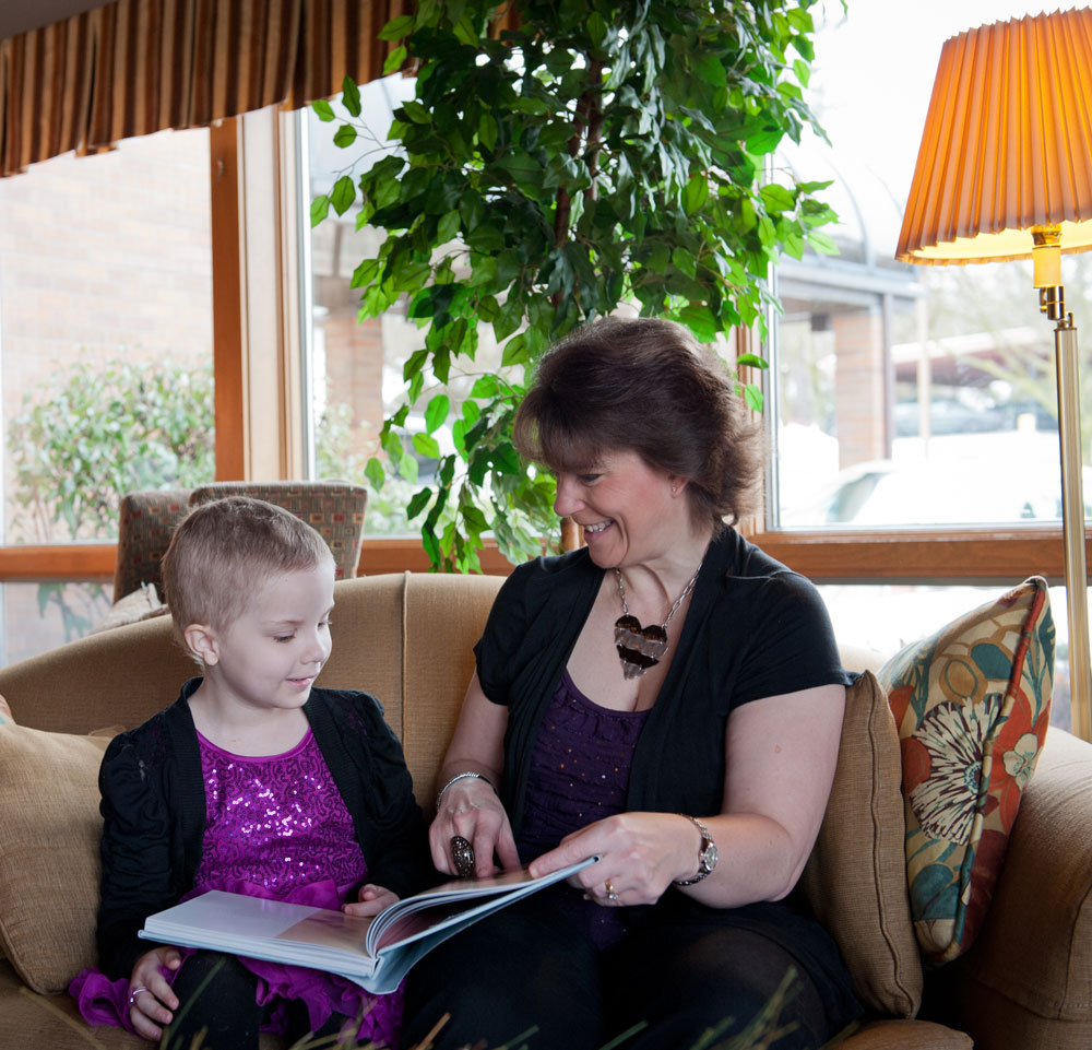 Mother reading to daughter